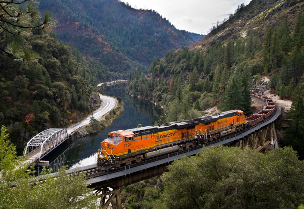 An eastbound BNSF baretable train crosses the Rock Creek Bridge in the Feather River Canyon. 